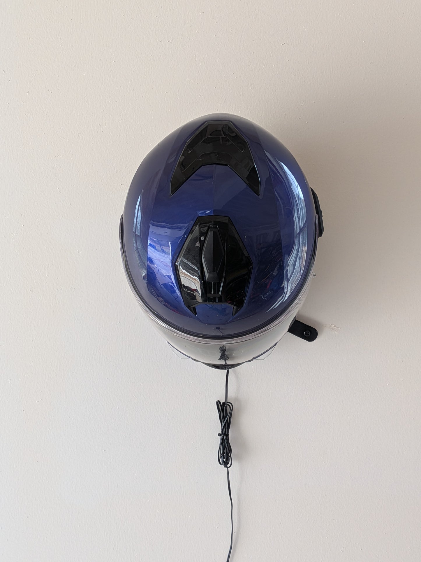 TorqueHook™ – Helmet & Gear Wall Organizer with Built-In USB-C Charging Port