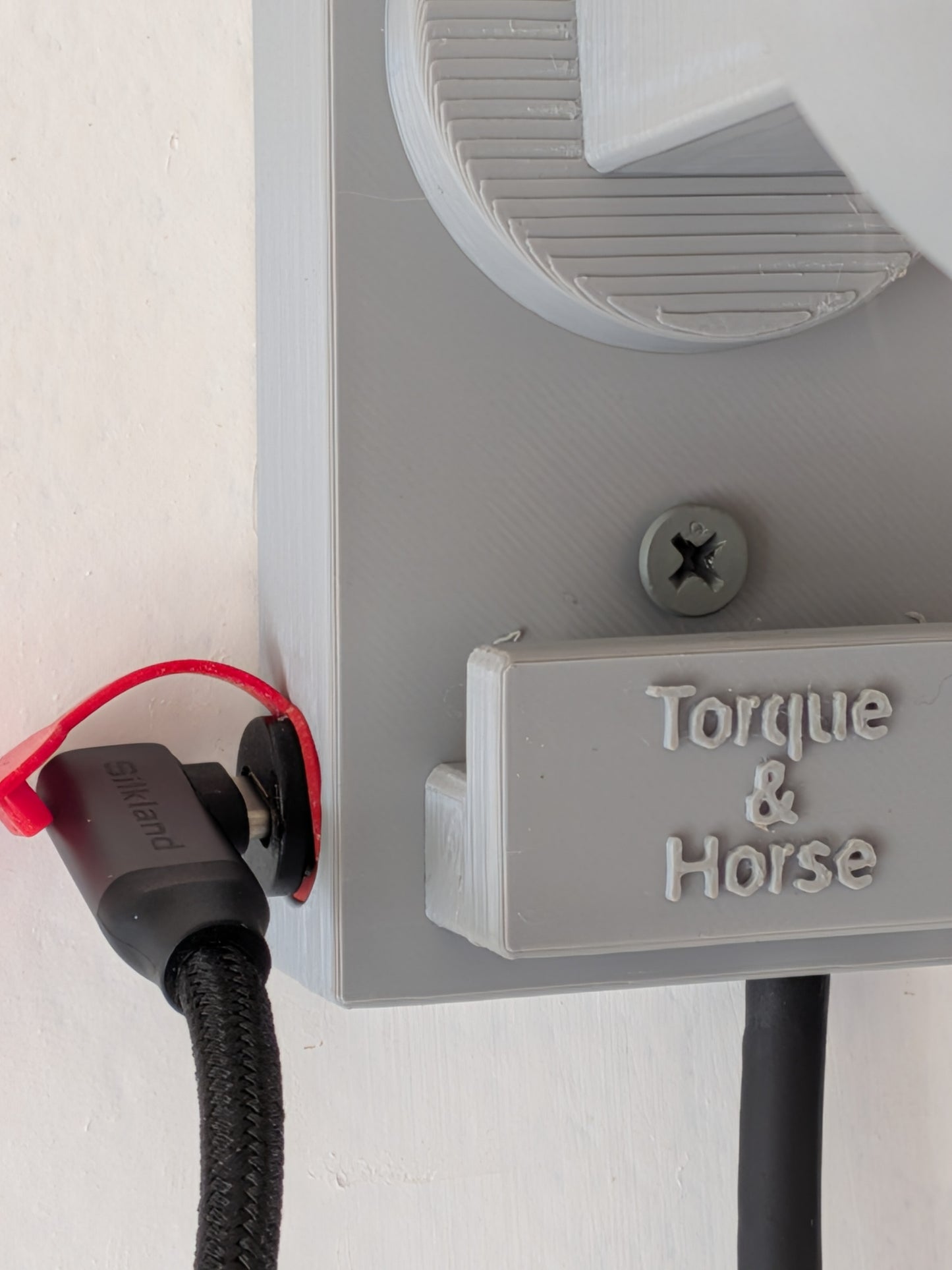 TorqueHook™ – Helmet & Gear Wall Organizer with Built-In USB-C Charging Port